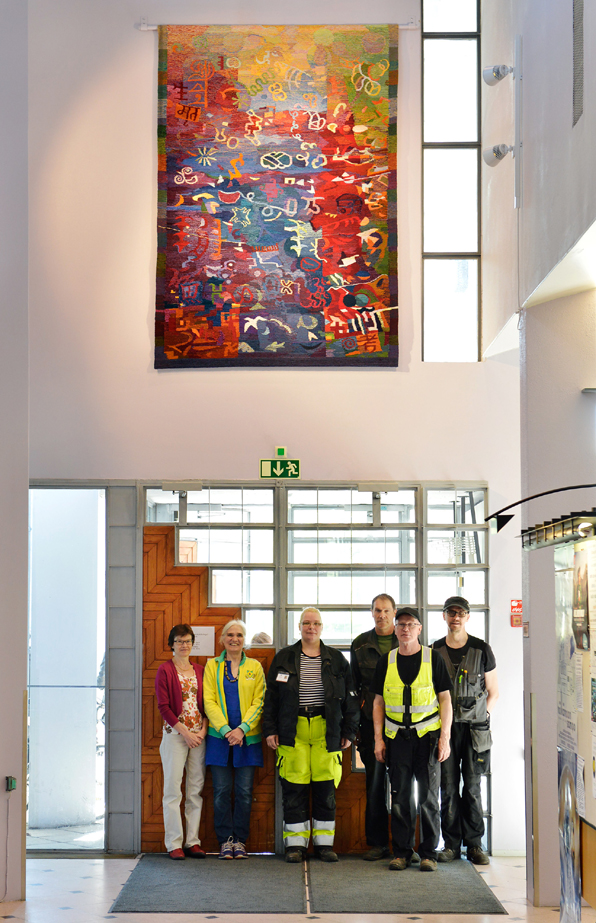 Tapestry 'Book Signs' with municipal construction workers, library director Taina Hyvnen and Ariadna Donner